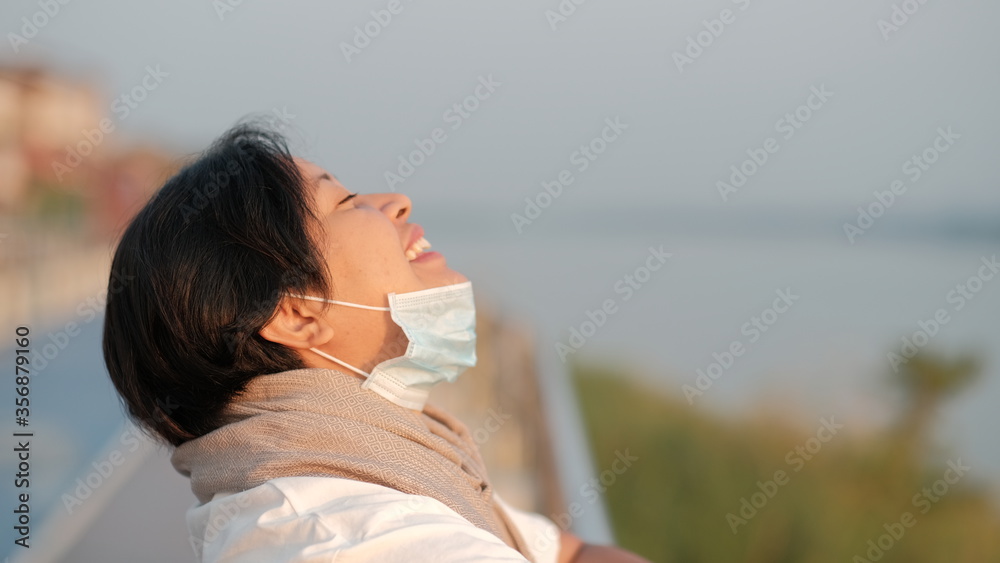Young women inhaling fresh air After escaping from containment during the corona virus outbreak. Young women inhaling fresh air After escaping from containment during the corona virus outbreak.