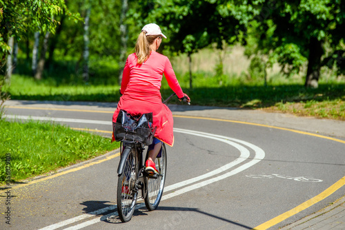 Cyclist ride on the bike path in the city Park  © licvin