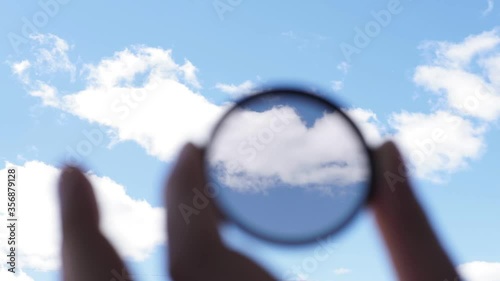 hand holds a circular polarizer filter Accessory for the photographer