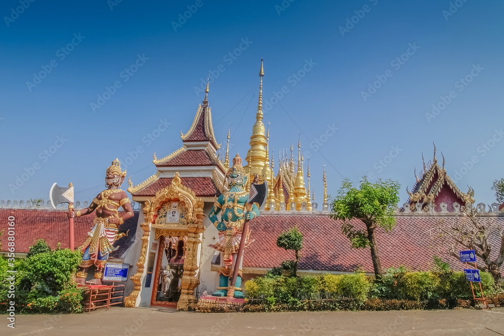 view of Giant goddess guardian in front of buddhist temple with blue sky background, Wat Phra That Suthon Mongkhon Khiri, Denchai District, Phrae Province, northern of Thailand.
