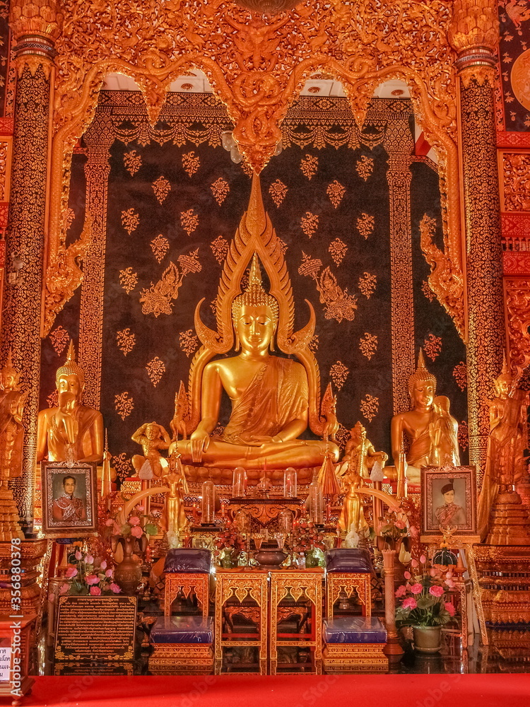 view of Golden buddha statue in buddhist temple, Wat Phra That Suthon Mongkhon Khiri, Denchai District, Phrae Province, northern of Thailand.