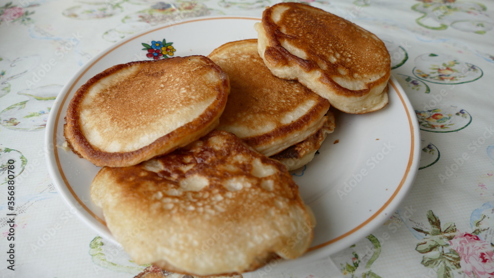 small pancakes on a plate for Breakfast small pancakes on a plate for Breakfast