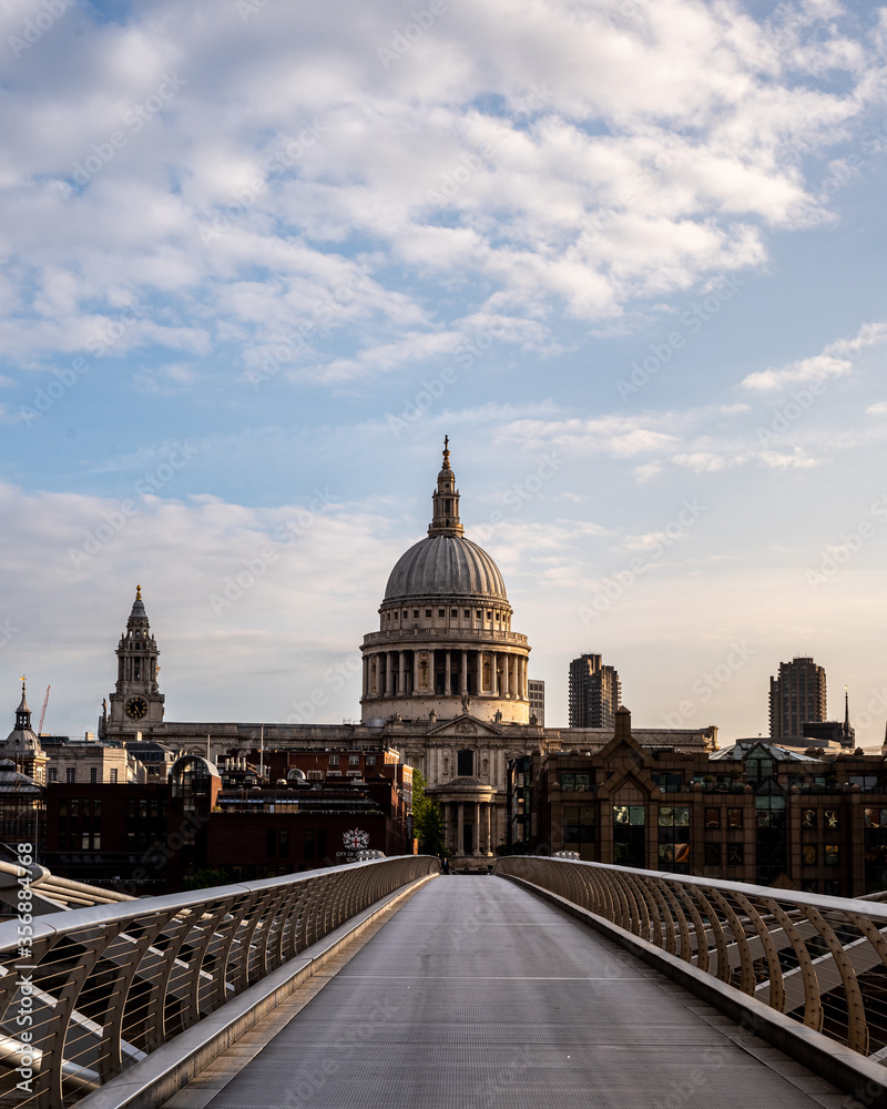st pauls cathedral london viewed from the end of millenium bridge at sunrise