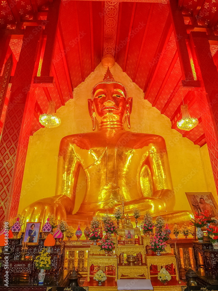 Ant's eye view of Phra Chao Ton Luang, Big Golden Buddha statue in buddhist temple, Wat Si Khom Kham, Phayao Province, northern of Thailand.