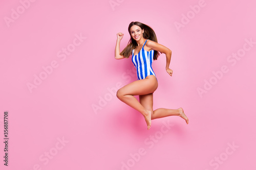 Full length body size view of nice-looking attractive stunning lovely thin motivated energetic cheerful cheery straight-haired girl jumping running marathon isolated over pink pastel color background