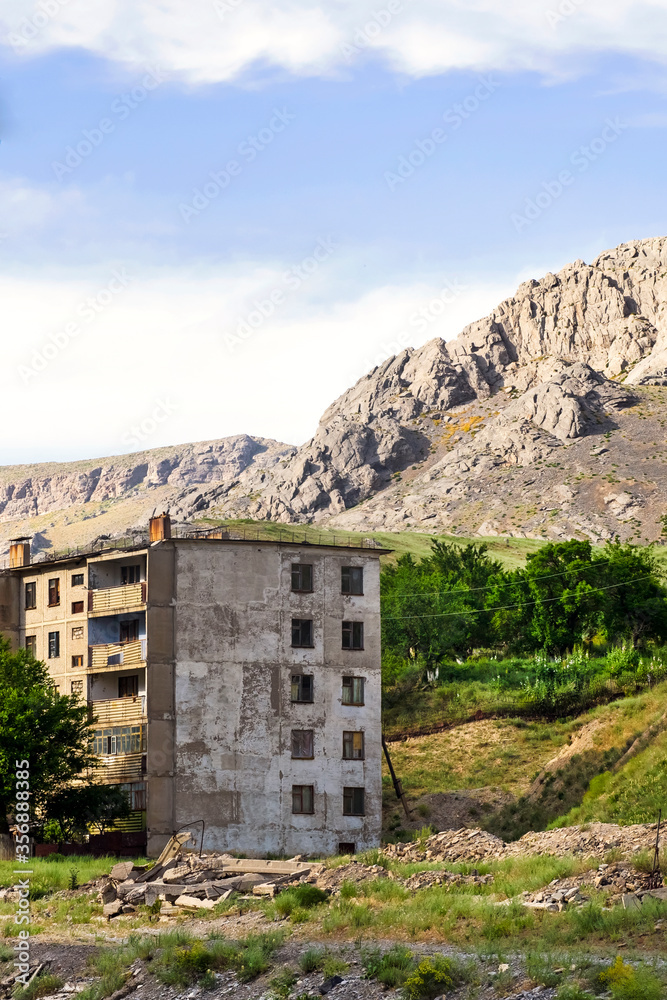 House of stones. Old house in the mountains. Abandoned house in the mountains. Mountain village. Abandoned city. Mountain landscape. Mountains near the house.