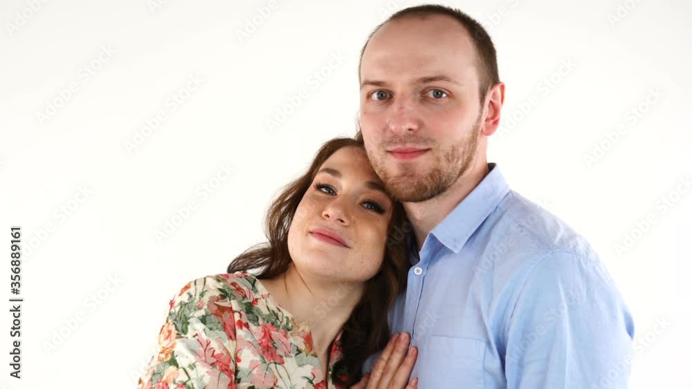 Portrait of happy couple isolated on white background. Attractive man and woman being playful Portrait of happy couple isolated on white background. Attractive man and woman being playful
