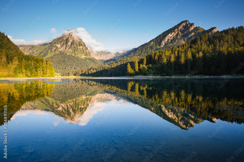 Morning views of the turquoise Lake Obersee. Location famous resort Nafels, Swiss Alps, Europe.