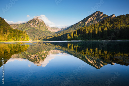 Fototapeta Naklejka Na Ścianę i Meble -  Morning views of the turquoise Lake Obersee. Location famous resort Nafels, Swiss Alps, Europe.