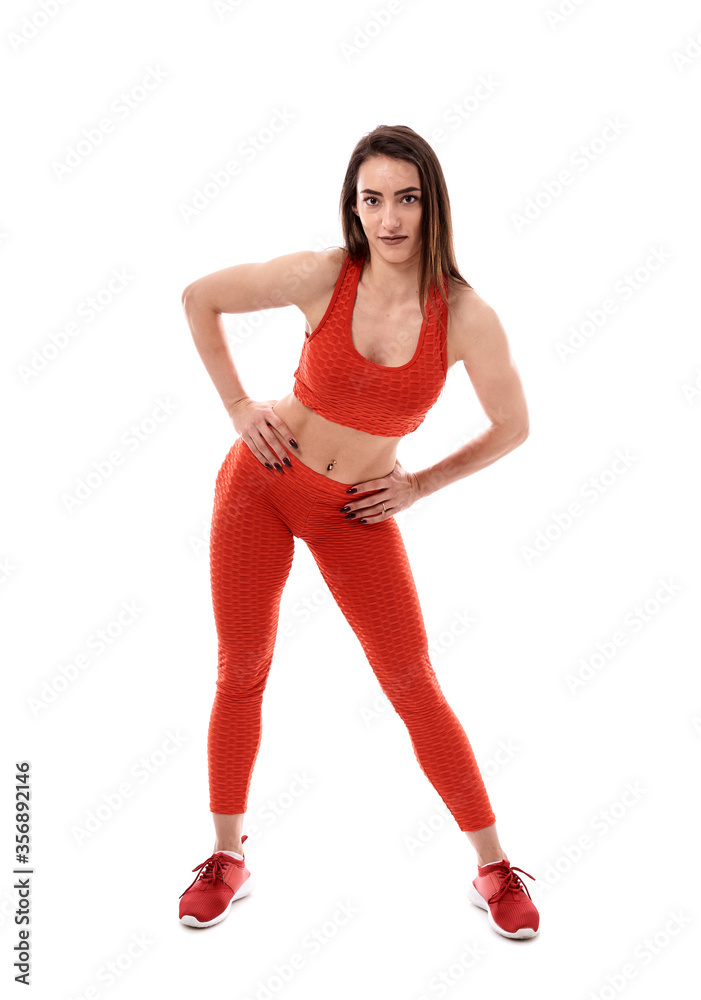 Young female fitness model on white Young female fitness model on white