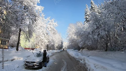 Novosibirsk Academgorodok in winter. Driving on a snowy Akademicheskaya street photo