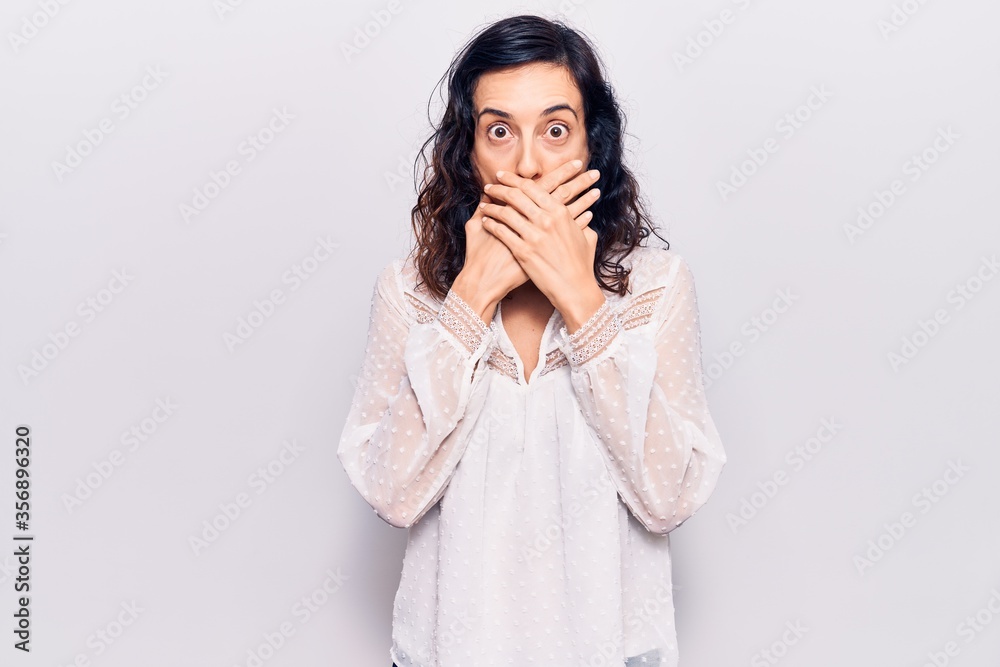 Young beautiful hispanic woman wearing casual clothes shocked covering mouth with hands for mistake. secret concept. Young beautiful hispanic woman wearing casual clothes shocked covering mouth with hands for mistake. secret concept.