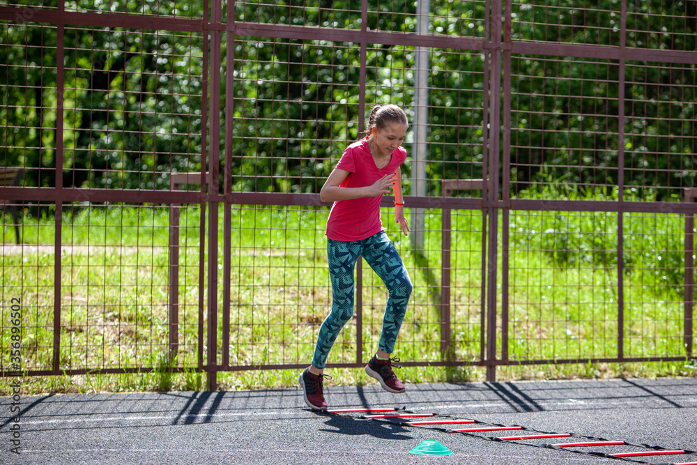 Young tennis player is working on physical training.