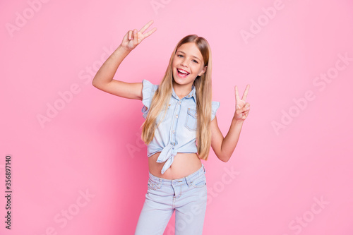 Portrait of her she nice attractive pretty lovely glad cheerful cheery preteen girl showing double v-sign having fun party enjoying isolated over pink pastel color background photo