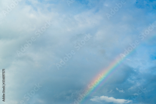 Beautiful rainbow across the sky after rain, Rainbow is a natural phenomenon. © ULTRAPOK