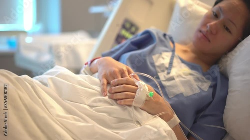 Asian Chinese Mother Patient resting in hospital bed
