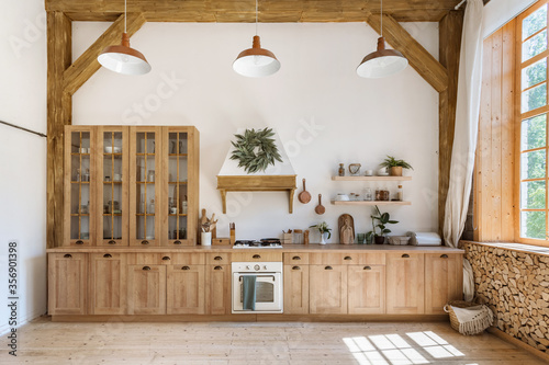 Wooden kitchen in modern interior with contemporary furniture