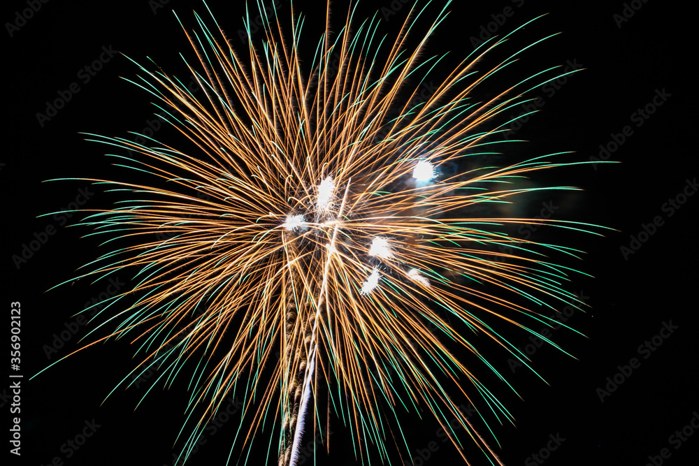 Fireworks display on dark sky background ,fireworks shining in the night sky. Fireworks display on dark sky background ,fireworks shining in the night sky.