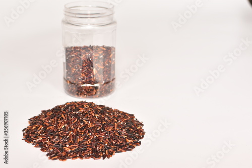 Red rice on a white background