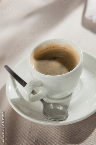 Cup of espresso coffee on a restaurant table, with a delicious crema, ready to be drunk