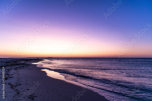 Sunset at the beach. Editing space. blue hour: blue, purple, yellow, orange colors. No people. Jurien bay, Western Australia WA, Australia, west coast