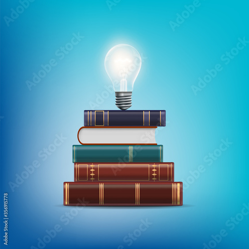 Stack of books with a light bulb above