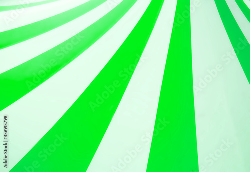 Abstract vintage pop art background design with thick green and white stripes with copyspace for text
