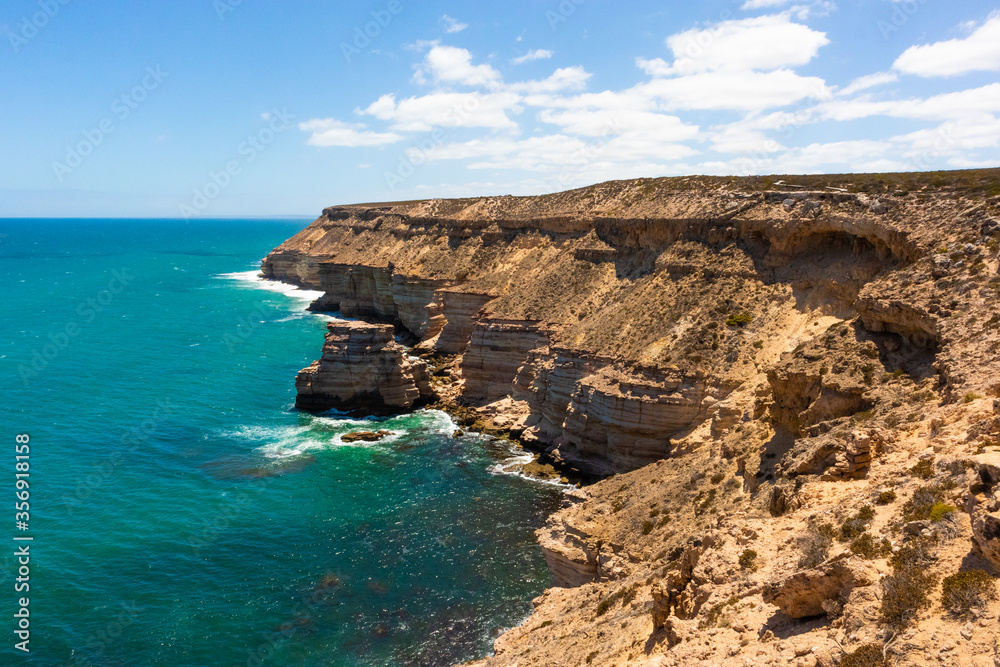 Steep cliff at the sea at Kalbarri national park and turquoise sea ocean, west coast, Western Australia WA, Australia