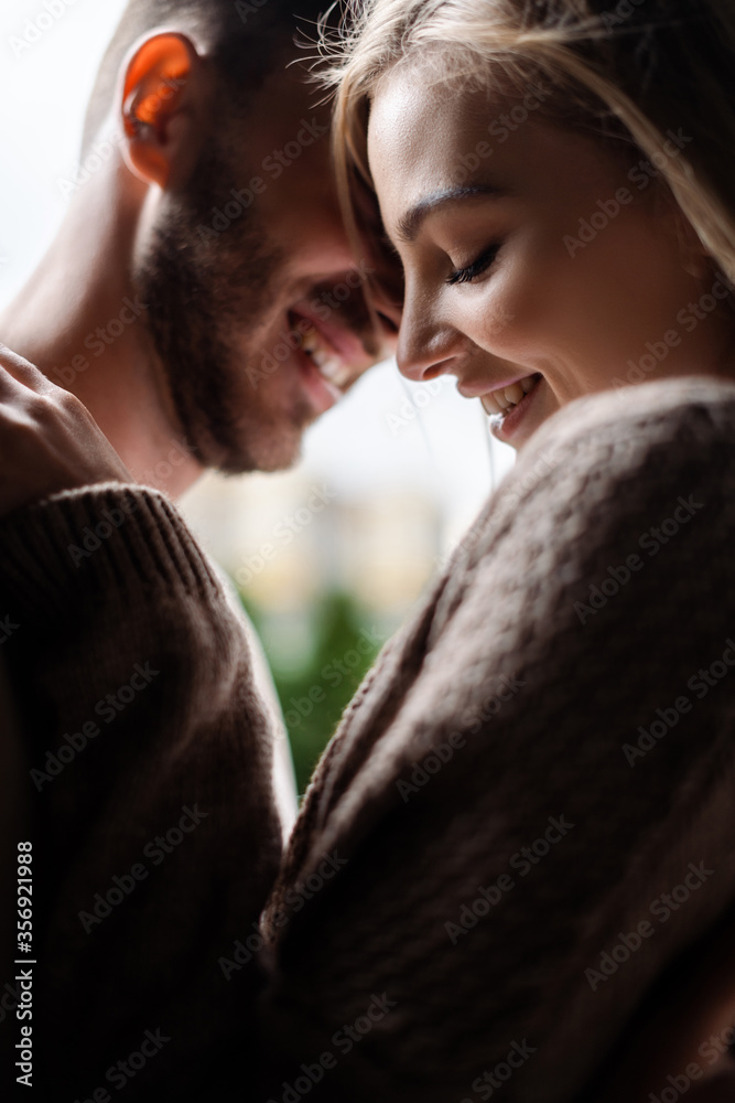 selective focus of cheerful girl with closed eyes near happy man selective focus of cheerful girl with closed eyes near happy man