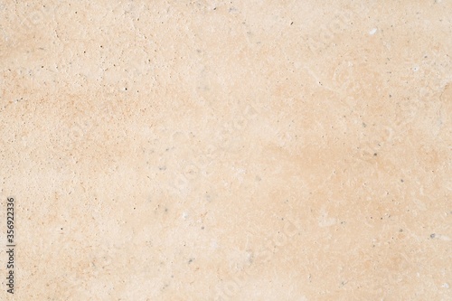 Travertine natural stone texture in beige and cream color with mottled aged effect