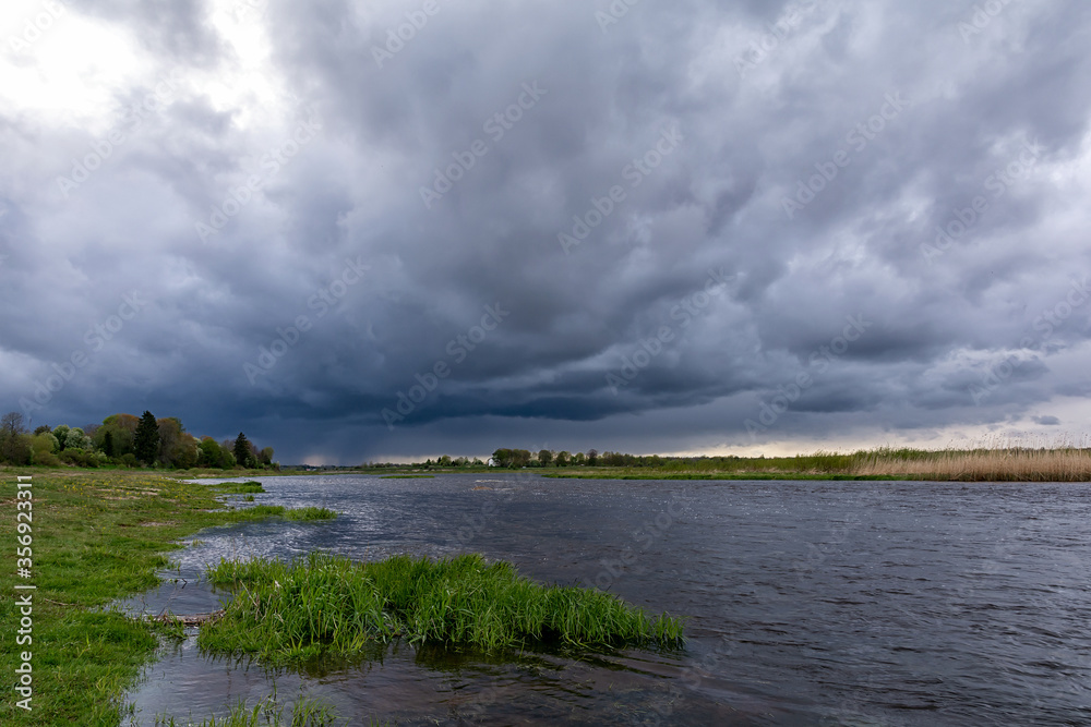 Before a thunderstorm on the Velikaya river, Pskov region