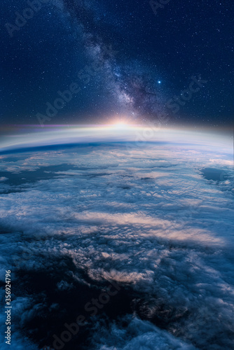 View of stars and milkyway above Earth from space. Beautiful space view of the Earth with cloud formation © Alican