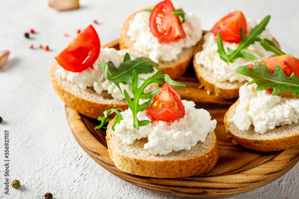 Healthy and tasty snack with bread, tomatoes and cottage cheese Healthy and tasty snack with bread, tomatoes and cottage cheese