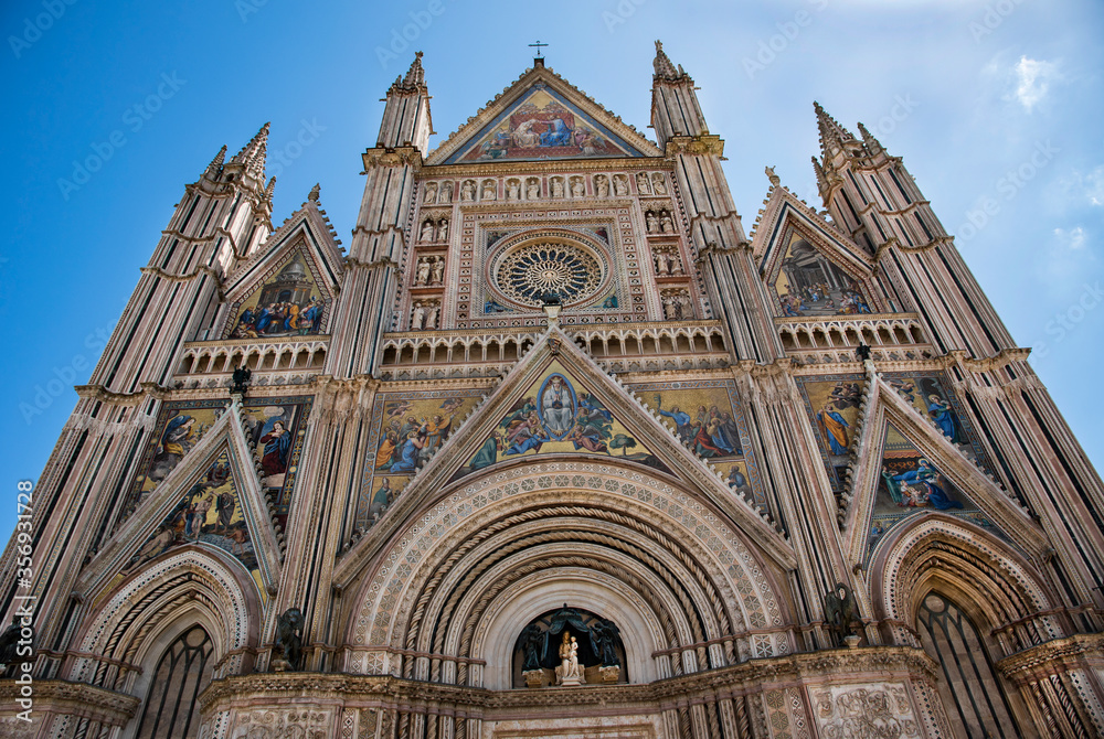 Italy, Orvieto, italian art, cathedral of Orvieto, Tuscany, View from below the facade of the cathedral, blue sky background