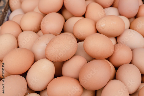 chicken eggs on wooden tray put to sell in the market