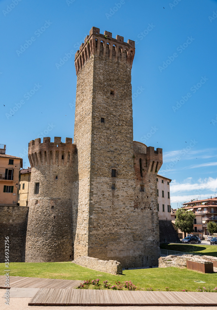 umbertide, italy,defense towers a medieval city in central Italy, front view with blue sky background and old houses, natural light