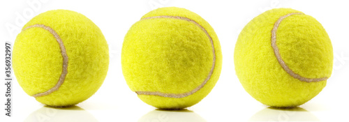 Yellow tennis balls isoladet on white background © ExQuisine
