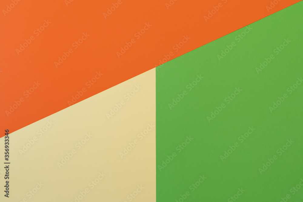 Orange, green and pastel yellow background. The orange colour is superimposed on the other two colours. Backgrounds, textures. Orange, green and pastel yellow background. The orange colour is superimposed on the other two colours. Backgrounds, textures.