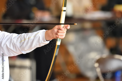 Japanese archery, a lady with concentration photo