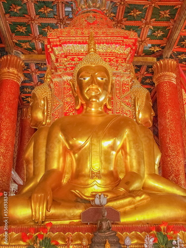 view of Golden buddha statue in buddhist temple, lanna style art 13th.-14th. Century., Wat Phumin, Nan Province, northern of Thailand.