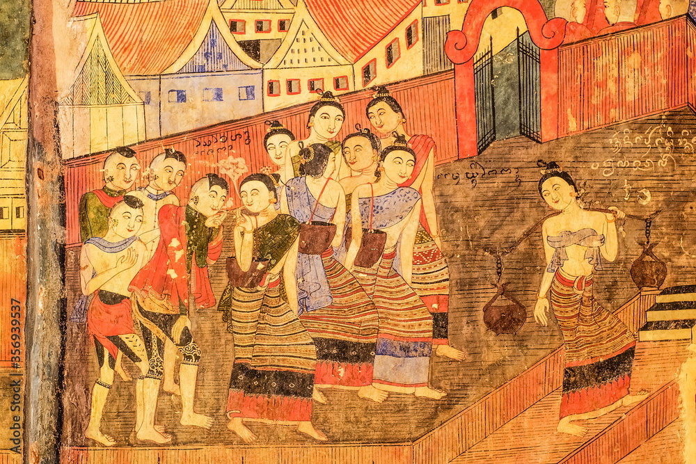 view of ancient mural wall painting (1894 C.E.) about Thai Lur people (local people) with traditional costume, Wat Phumin, Nan Province, northern of Thailand.