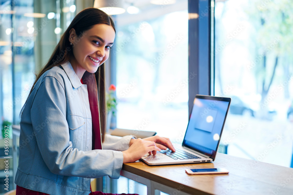 Portrait of positive skilled female freelancer making plans Portrait of positive skilled female freelancer making plans