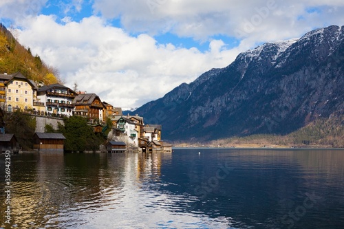 Beautiful view of houses on mountains around Hallstatt - small village. UNESCO world heritage site, old European architecture.