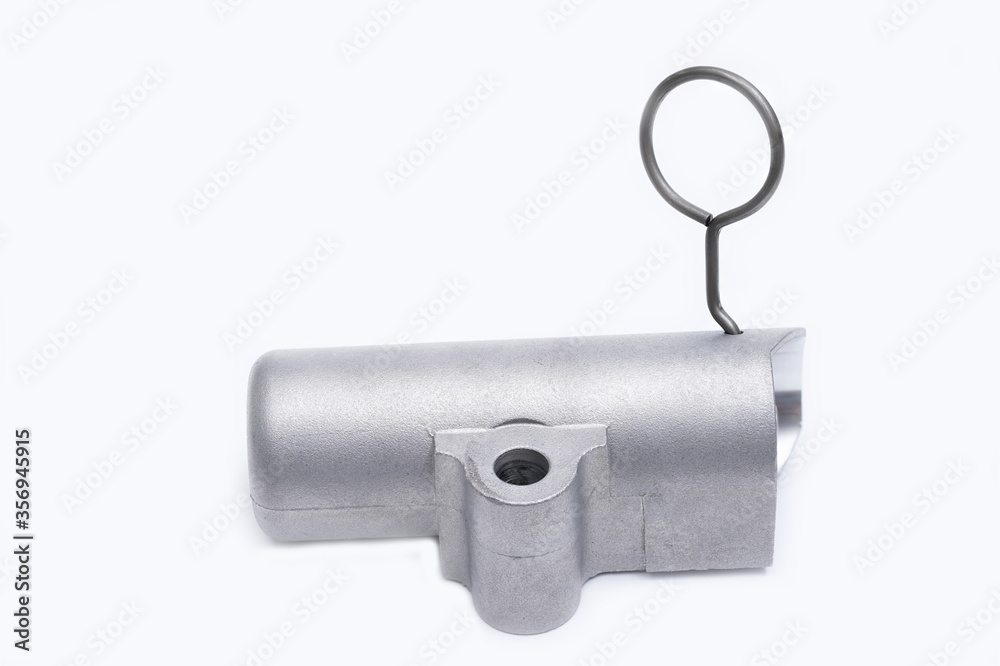 Tension mechanism roller of a timing belt of an internal combustion engine on a white background. The concept of new spare parts and maintenance of vehicles Tension mechanism roller of a timing belt of an internal combustion engine on a white background. The concept of new spare parts and maintenance of vehicles