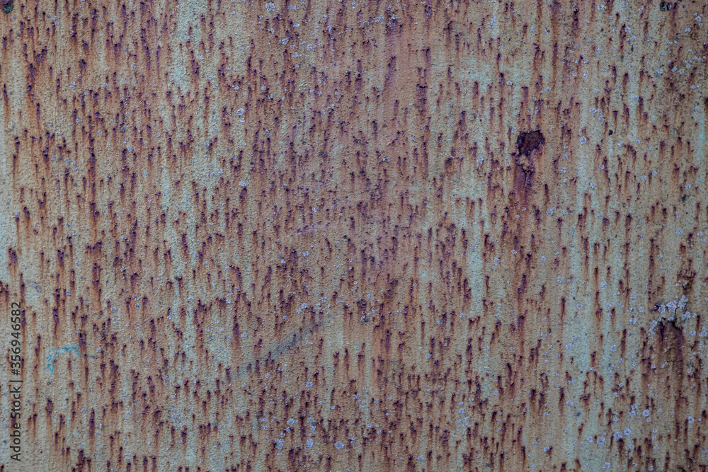 background and texture of old metal surface is covered with blue paint and rust