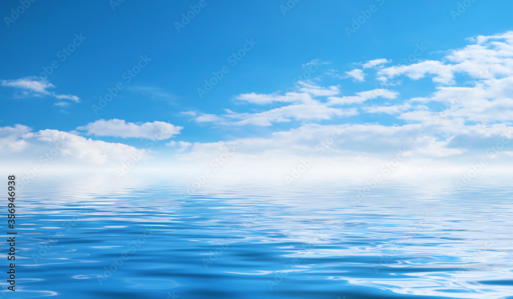 Obraz premium Summer seascape. Blue sea and sky with fluffy clouds. Bright sunny day, tropical beach.