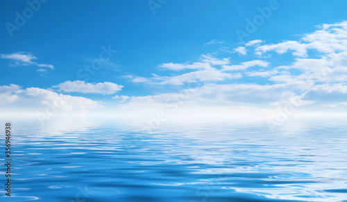 Summer seascape. Blue sea and sky with fluffy clouds. Bright sunny day, tropical beach.