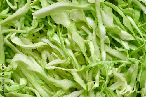 Slaw green cabbage macro image, shredded salad.