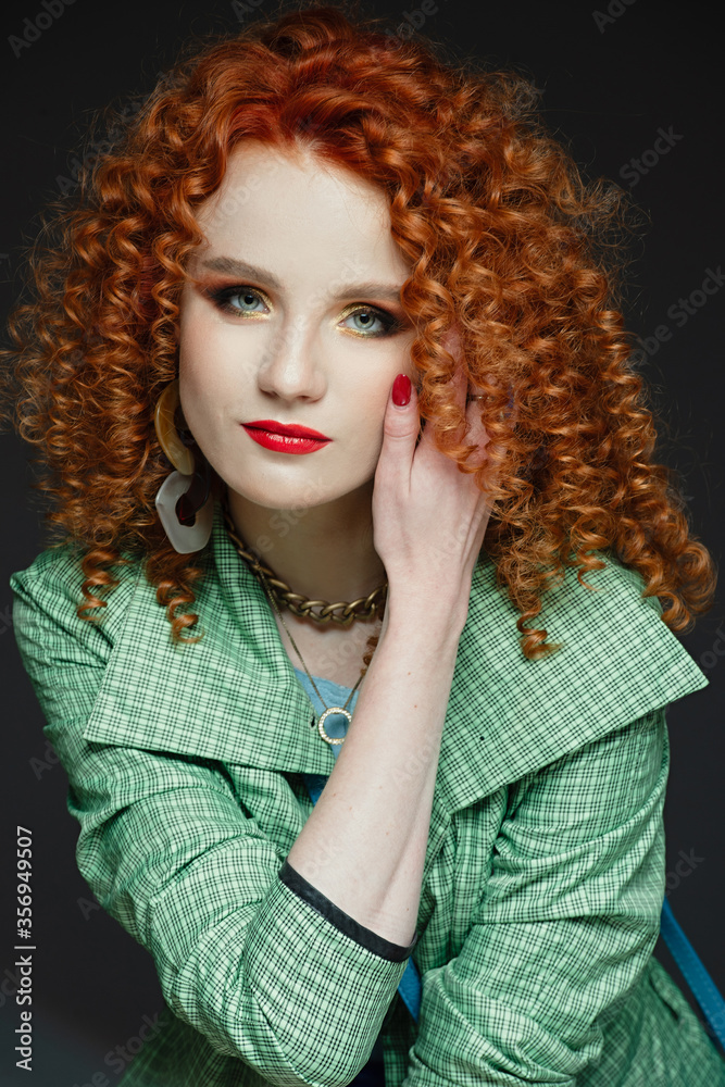 Fototapeta premium girl with red hair and white skin, curly curly hair, lush hairstyle, red lipstick, beautiful makeup,