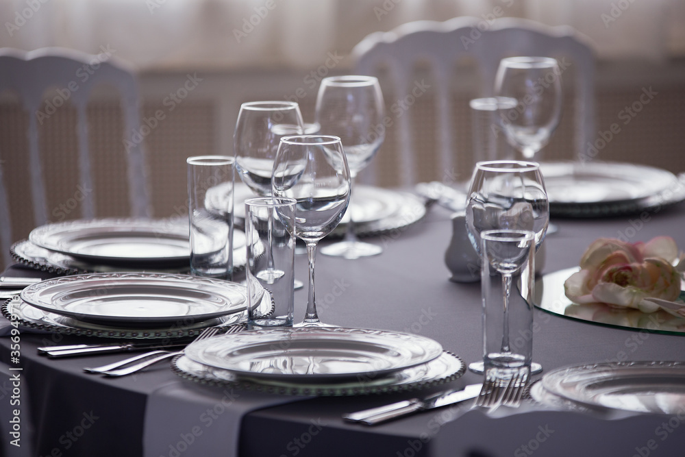 table setting, festive dinner, white porcelain dishes, wine glasses, wedding banquet,